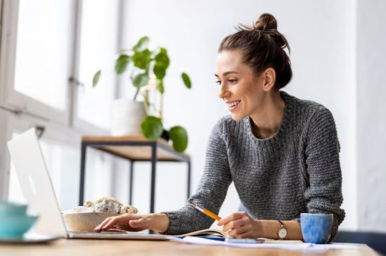 A fintech professional working on her laptop