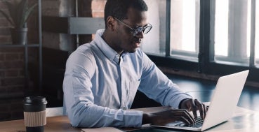 A finance expert working on laptop