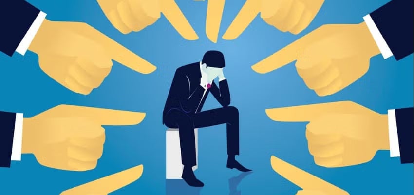 An illustration of a man in a suit with fingers pointing at him